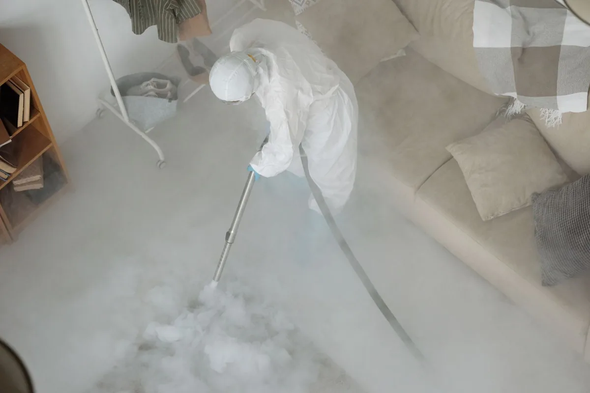 Biohazard cleanup technician in protective equipment, Apison, TN